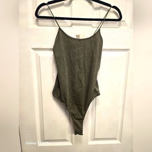 Womans new greenish body suit